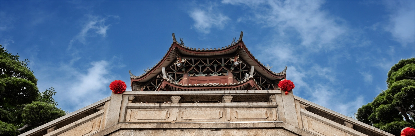 The Meizhou Mazu Ancestral Temple facade under a blue sky.