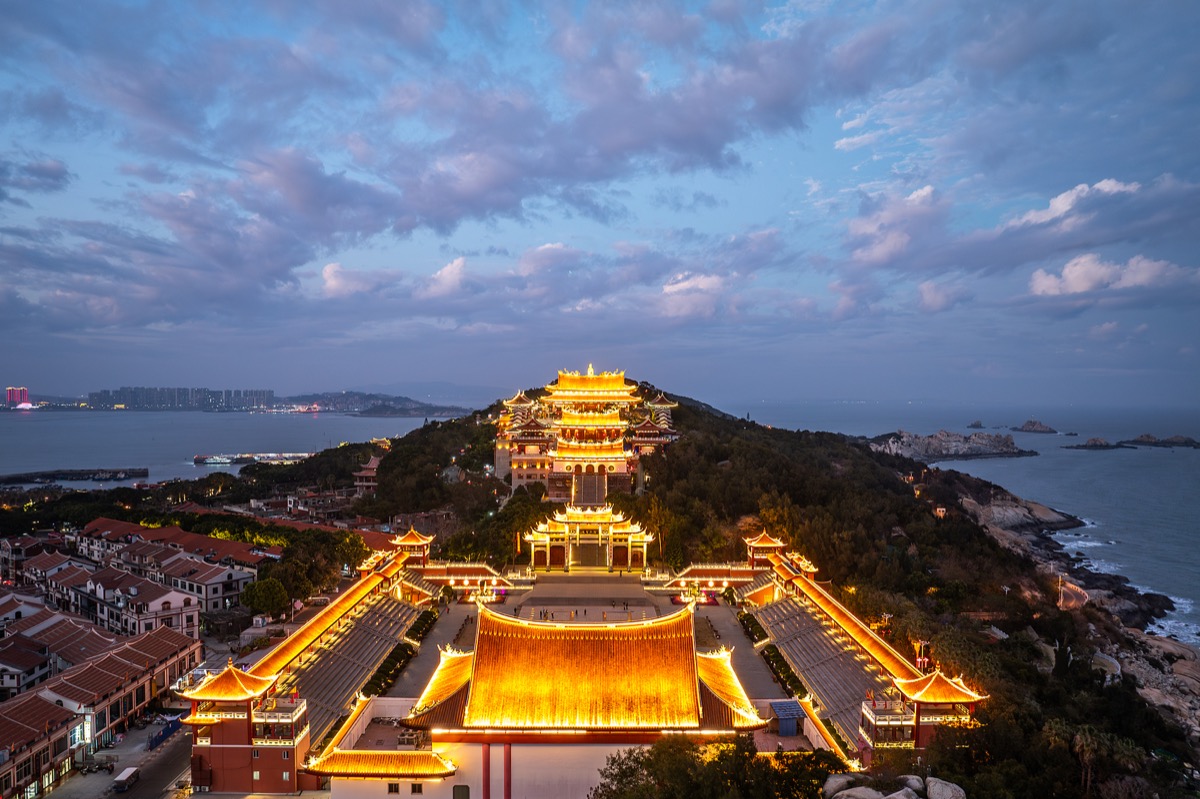 Aerial view of Meizhou Mazu Temple by the sea.